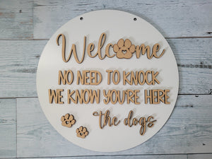 Welcome No need to knock. We know you're here. The Dogs. Door Hanger